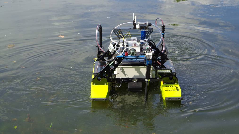 An unmanned surface vehicle (USV) is shown in a lake.