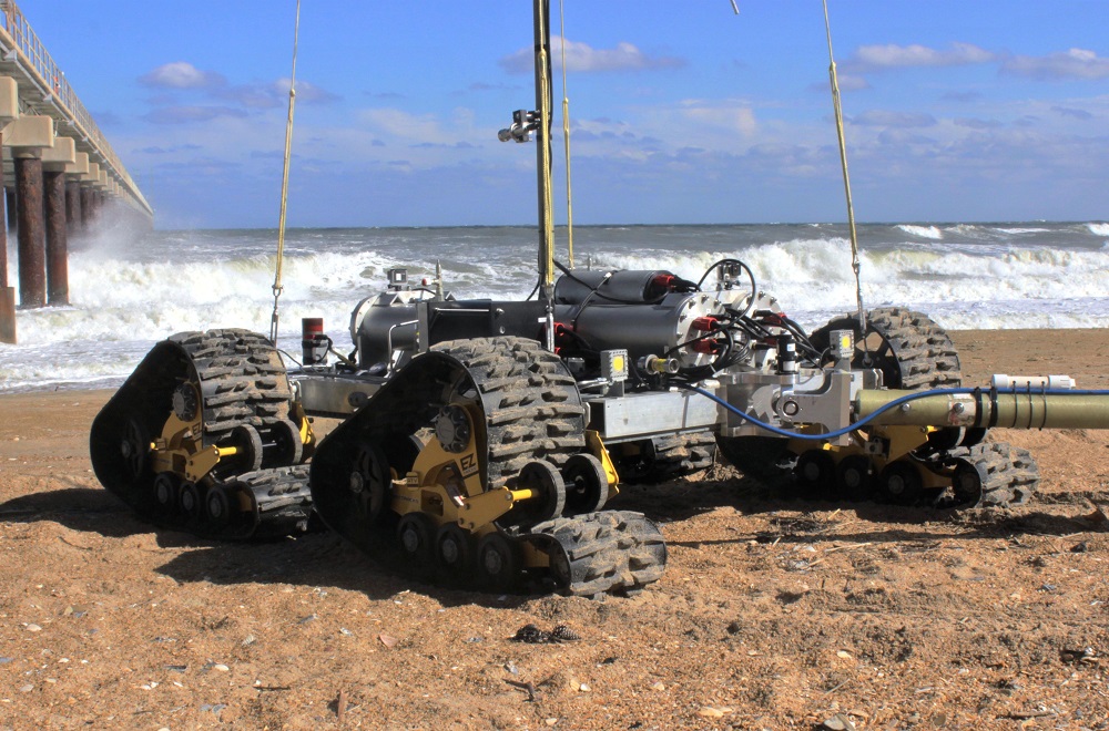 The SeaView Systems SurfROVer robotic remote operated vehicle is shown towing a sensor array in the littoral surf zone.
