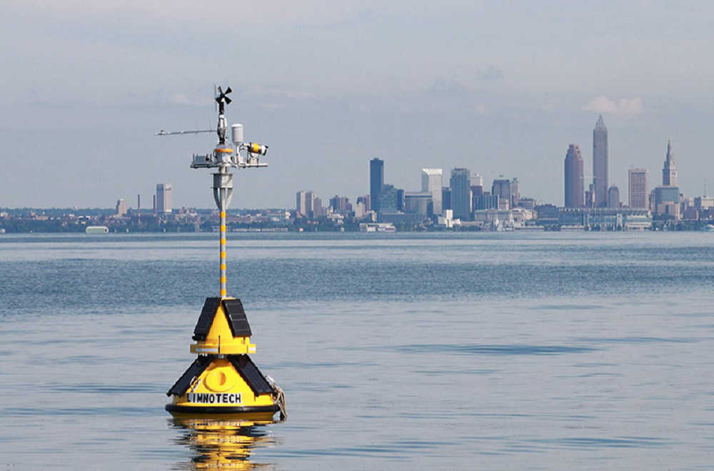 A LimnoTech data buoy, featuring the SeaView Systems SVS-603 wave sensor, is shown deployed near Cleveland, OH.