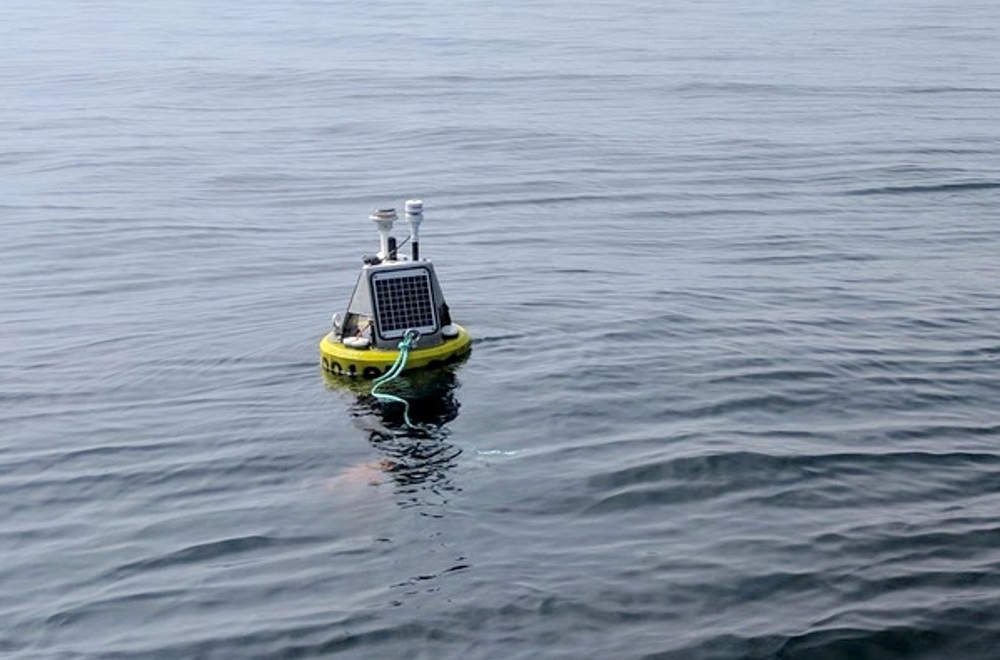 A buoy featuring the SeaView Systems SVS-603 wave sensor is shown deployed near Stannard Rock LIghthouse in Lake Superior.