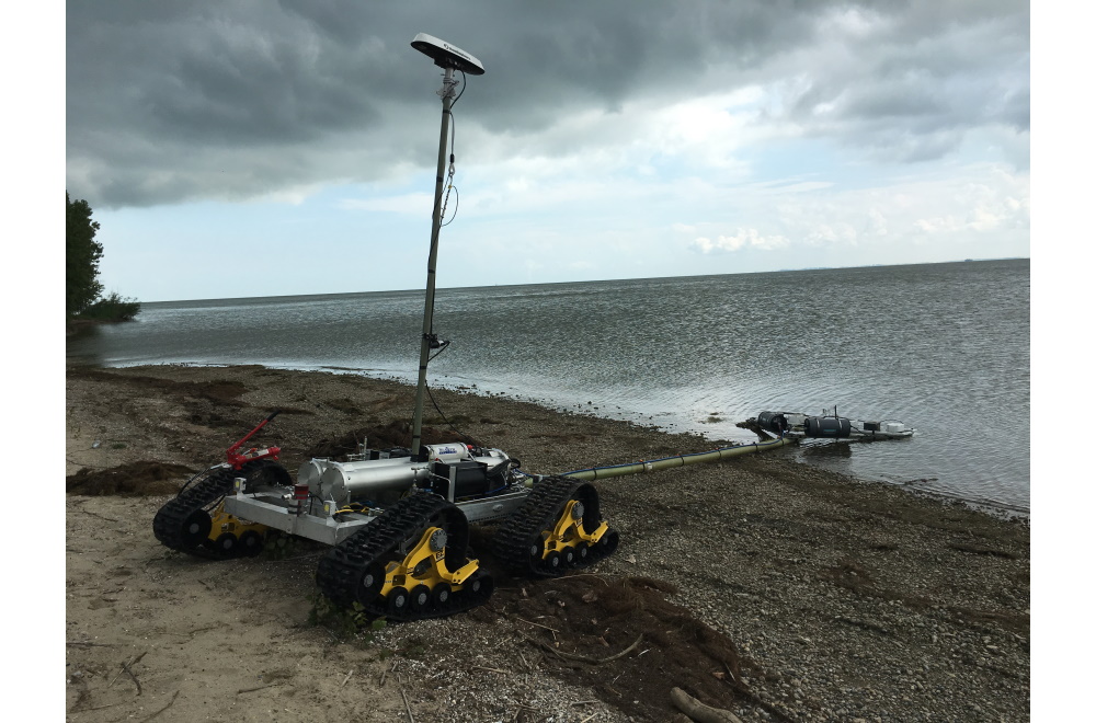 The SeaView Systems SurfROVer robotic remote operated vehicle is shown towing a sensor array in the littoral surf zone.